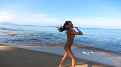 Naked amateur alone on beach