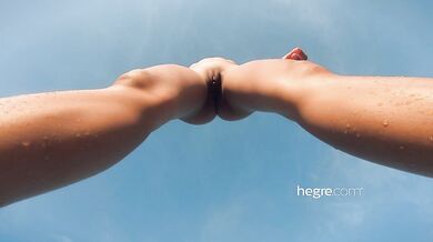 Naked amateur alone on beach