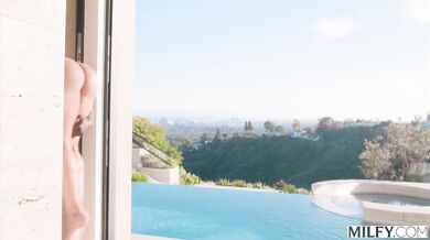 See Sandy Love surrender her mature curves to a young lifeguard's massive black member by the pool