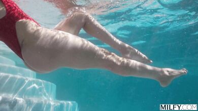 See Sandy Love surrender her mature curves to a young lifeguard's massive black member by the pool